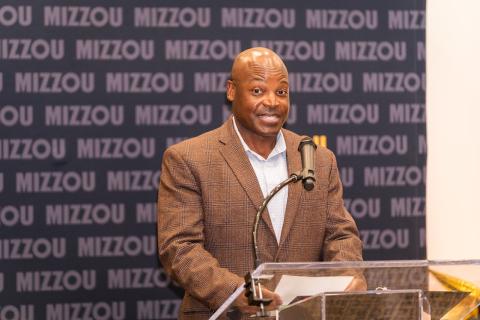 Dr. Raymond Summerville at a podium